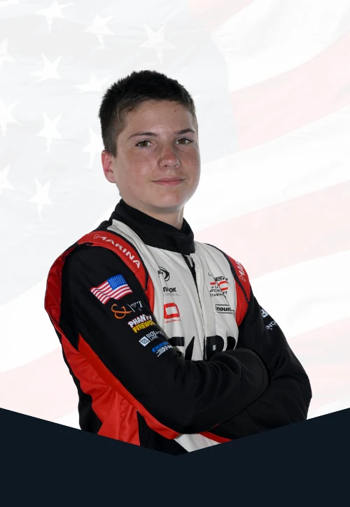 Roman Felber in FLBR Motorsport race suits with an American flag backdrop.